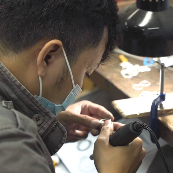 Jeweler working on piece of custom jewelry